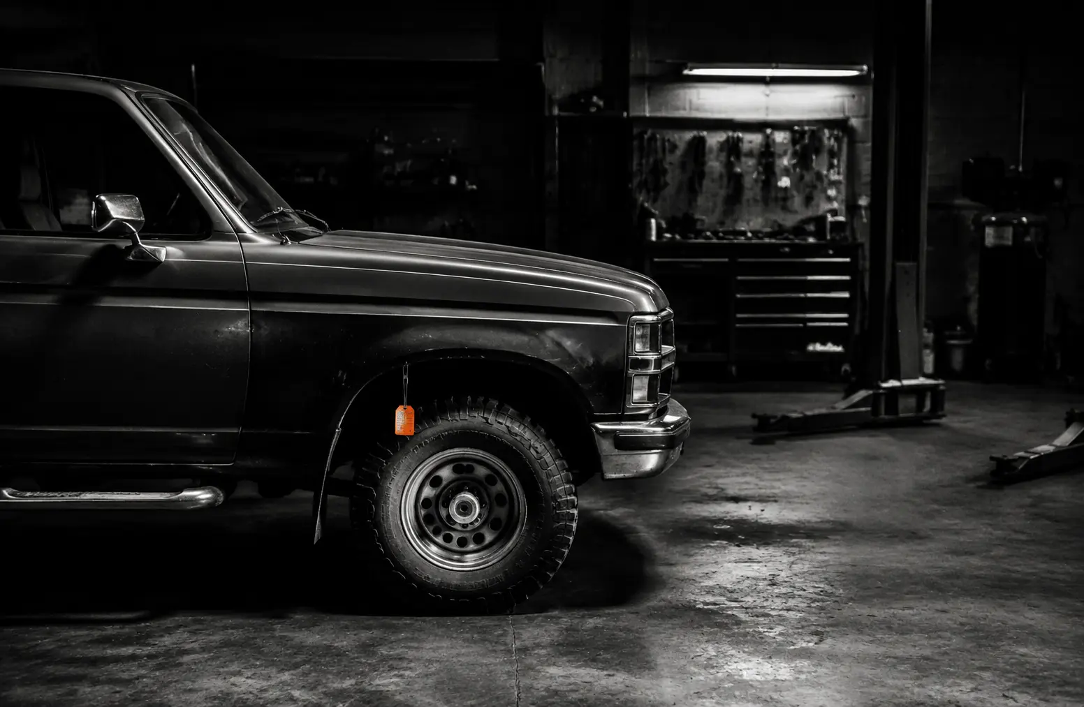 A repaired pickup truck inside an independent garage